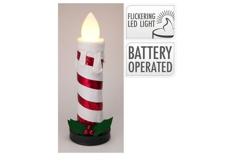 Battery-operated LED candle with candy cane design on a beige background